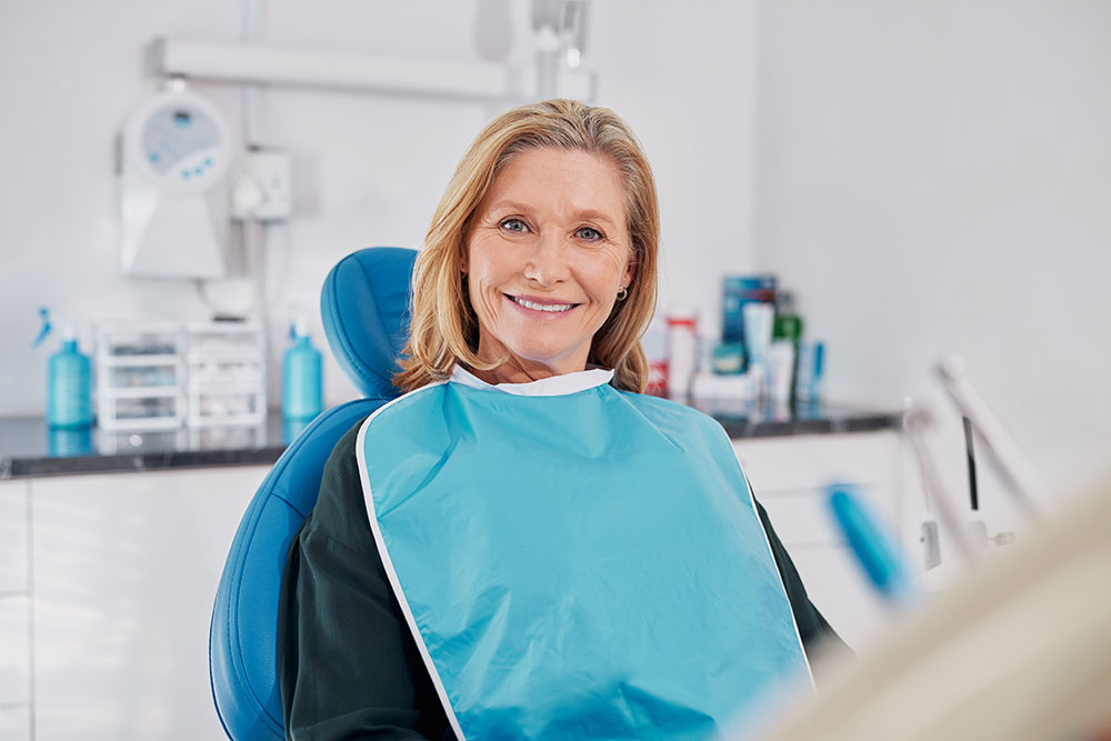 dental patient wearing her new dentures