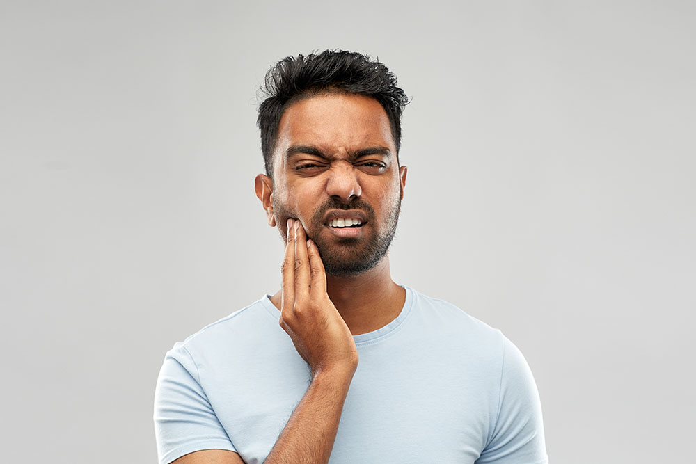 man with jaw pain